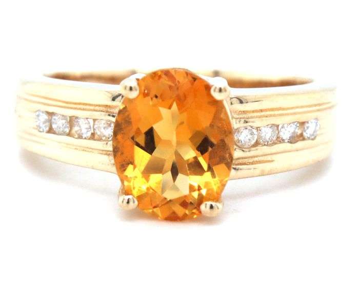 14kt Yellow gold oval citrine and channel set diamond ring