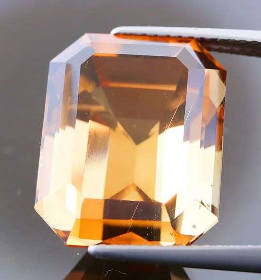 Electric flashing through rich color! Huge 23.08ct Imperial Topaz!