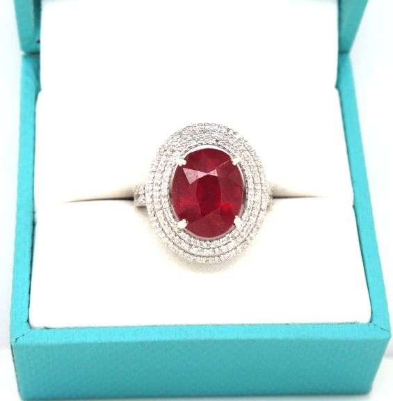 Darling 8.15CTS Oval Faceted Ruby & 0.45CTW Diamond Triple Halo Ring in Sterling Silver