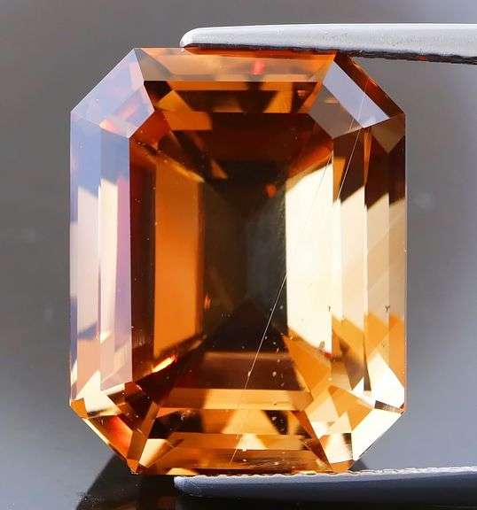 Electric flashing through rich color! Huge 23.08ct Imperial Topaz!