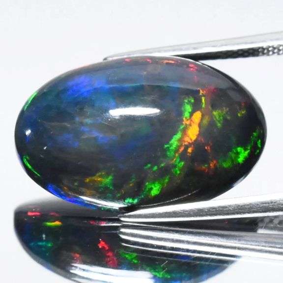 Huge! 20mm high fire Black Opal weighing 8.91 carats!