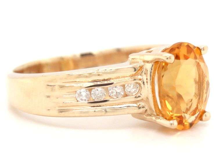 14kt Yellow gold oval citrine and channel set diamond ring