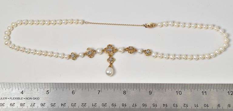 Marvelous 10k Yellow Gold Pearl Necklace with Diamond Accents