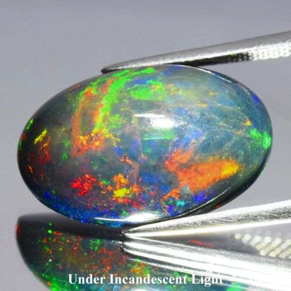 Huge! 20mm high fire Black Opal weighing 8.91 carats!