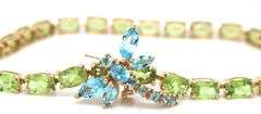 14kt Yellow gold oval peridot bracelet with blue topaz dragonfly