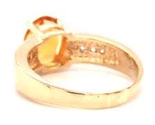 14kt Yellow gold oval citrine and channel set diamond ring