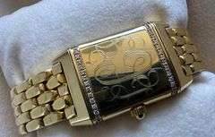 Simply stunning 18k yellow gold Jaeger-LeCoultre Reverso wristwatch with diamond accents