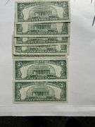 Seven 1953 Red Seal $2 US Notes.