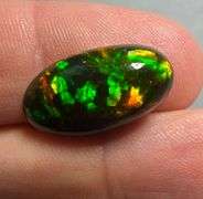 It's over 20mm long! And full of color! 5.80ct Black Opal from Ethiopia!