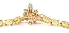 14kt Yellow gold oval peridot bracelet with blue topaz dragonfly