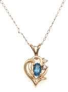 Set of 14kt Yellow gold oval blue topaz and diamond accent pendant on chain with matching earrings