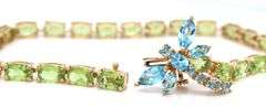 14kt Yellow gold oval peridot bracelet with blue topaz dragonfly