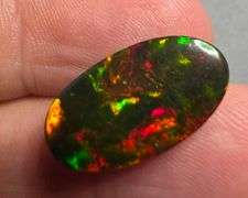 It's over 20mm long! And full of color! 5.80ct Black Opal from Ethiopia!