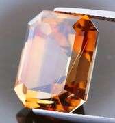 Electric flashing through rich color! Huge 23.08ct Imperial Topaz!