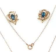 Set of 14kt Yellow gold oval blue topaz and diamond accent pendant on chain with matching earrings