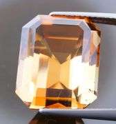 Electric flashing through rich color! Huge 23.08ct Imperial Topaz!