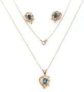 Set of 14kt Yellow gold oval blue topaz and diamond accent pendant on chain with matching earrings