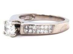 14kt White gold RBC diamond and princess cut Invisible set ring
