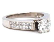 14kt White gold RBC diamond and princess cut Invisible set ring