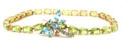 14kt Yellow gold oval peridot bracelet with blue topaz dragonfly