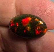 It's over 20mm long! And full of color! 5.80ct Black Opal from Ethiopia!