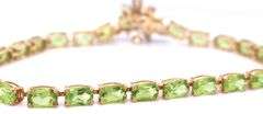 14kt Yellow gold oval peridot bracelet with blue topaz dragonfly
