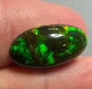 It's over 20mm long! And full of color! 5.80ct Black Opal from Ethiopia!