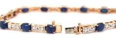 14kt Yellow gold 7.5ctw oval sapphire and diamond accent tennis bracelet