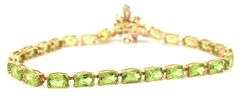 14kt Yellow gold oval peridot bracelet with blue topaz dragonfly