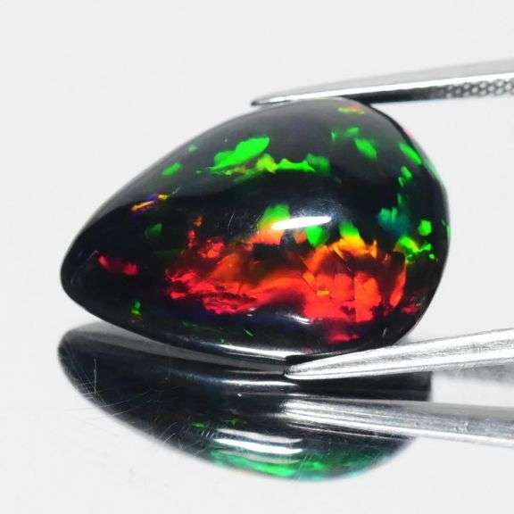 Huge! 19.5mm high fire Black Opal weighing 8.27 carats!