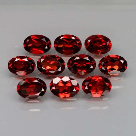 Amazing 9.85ct oval cut red Garnet set