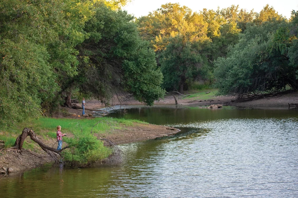 A family checking the fishing potential of ponds and tanks.