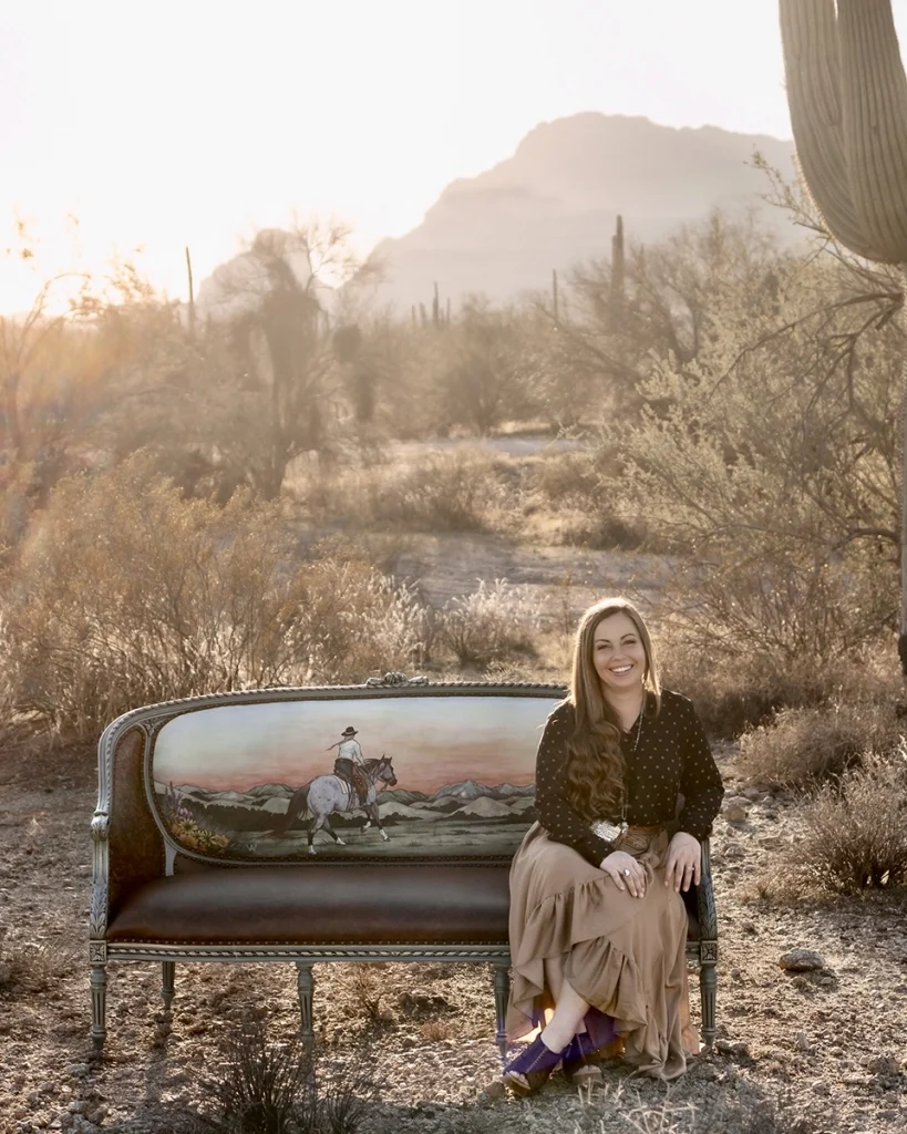 Sierra Shores sitting on a couch she created for The Art of the Cowgirl. 