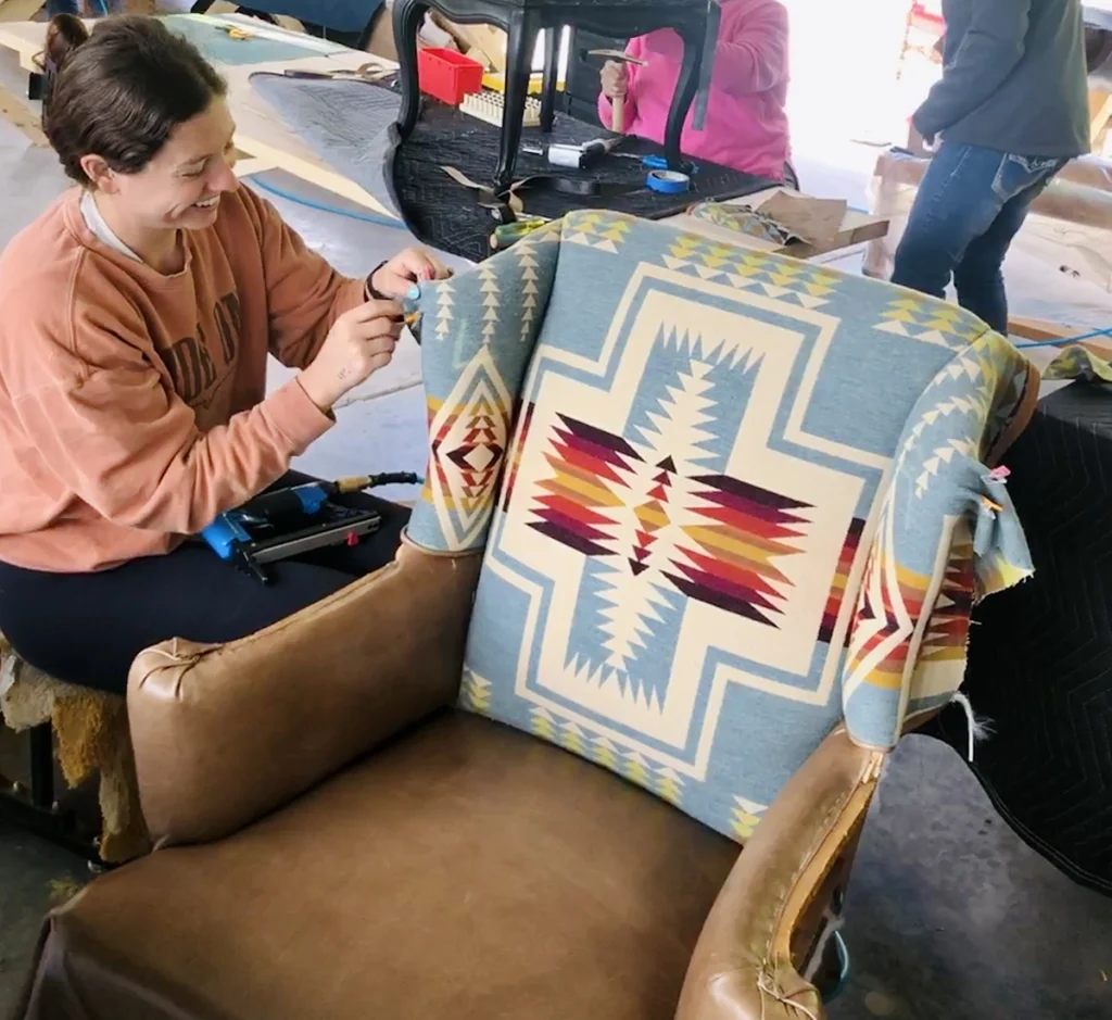 Stitching a quilt during a workshop.