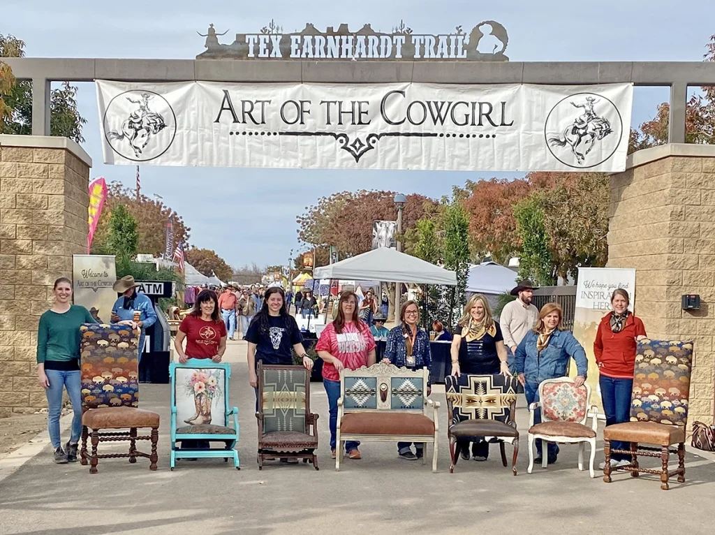 The Art of the Cowgirl workshop attendees stand with their creations.