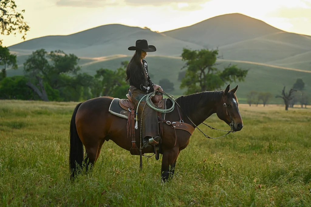 A cowgirl on a Quarter Horse.