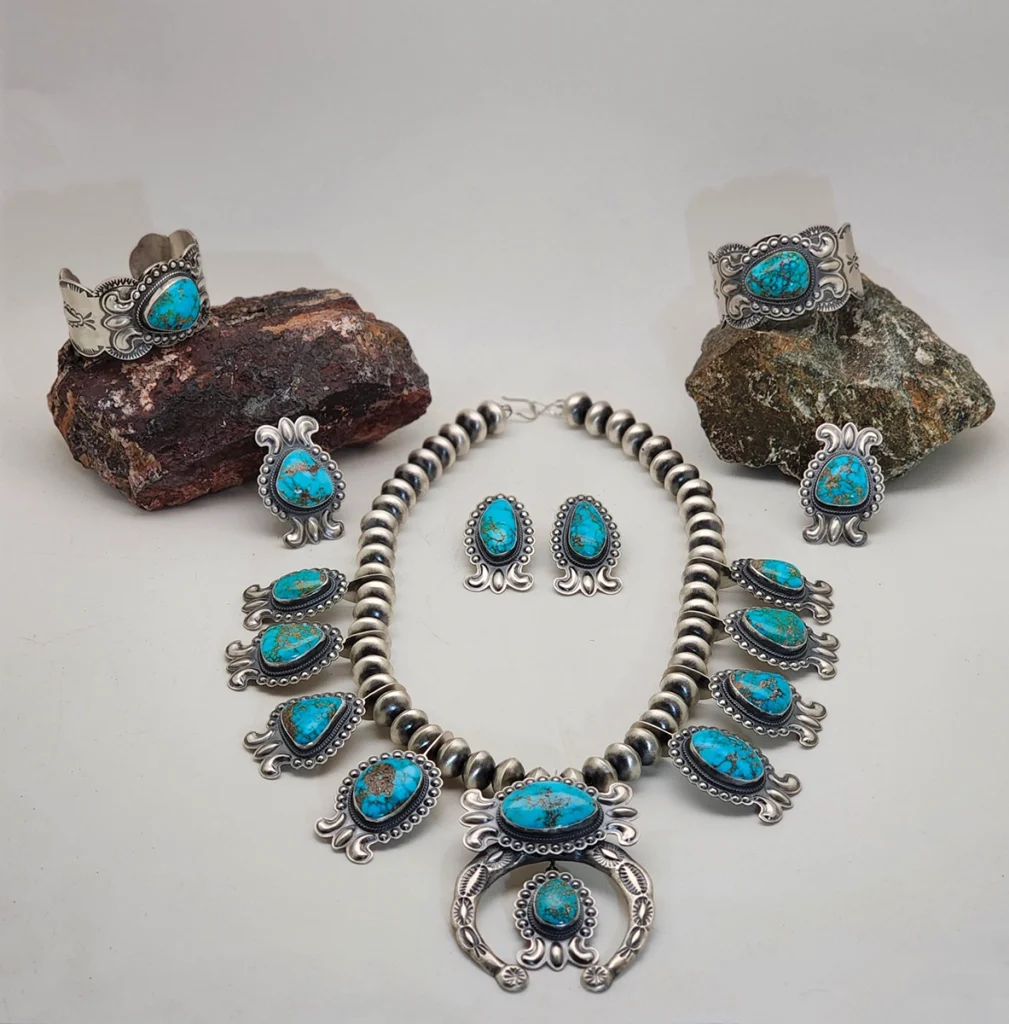 A turquoise squash blossom set.