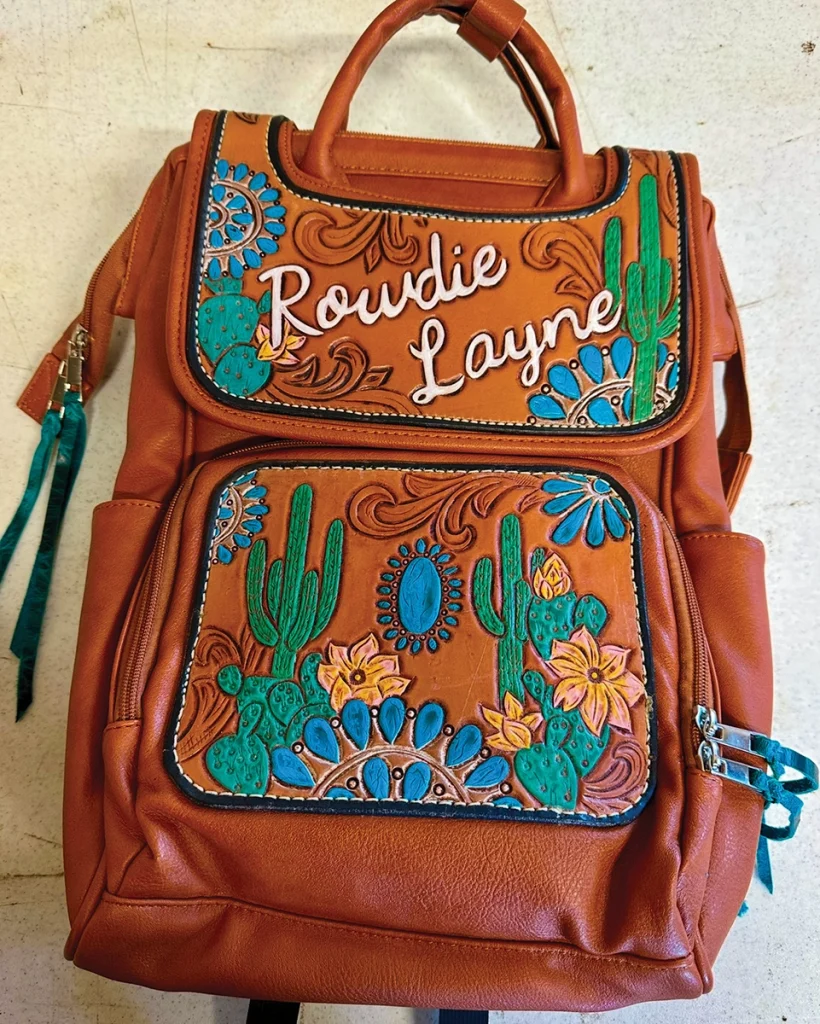A diaper bag with a tooling design from Rockabilly Filly Designs.