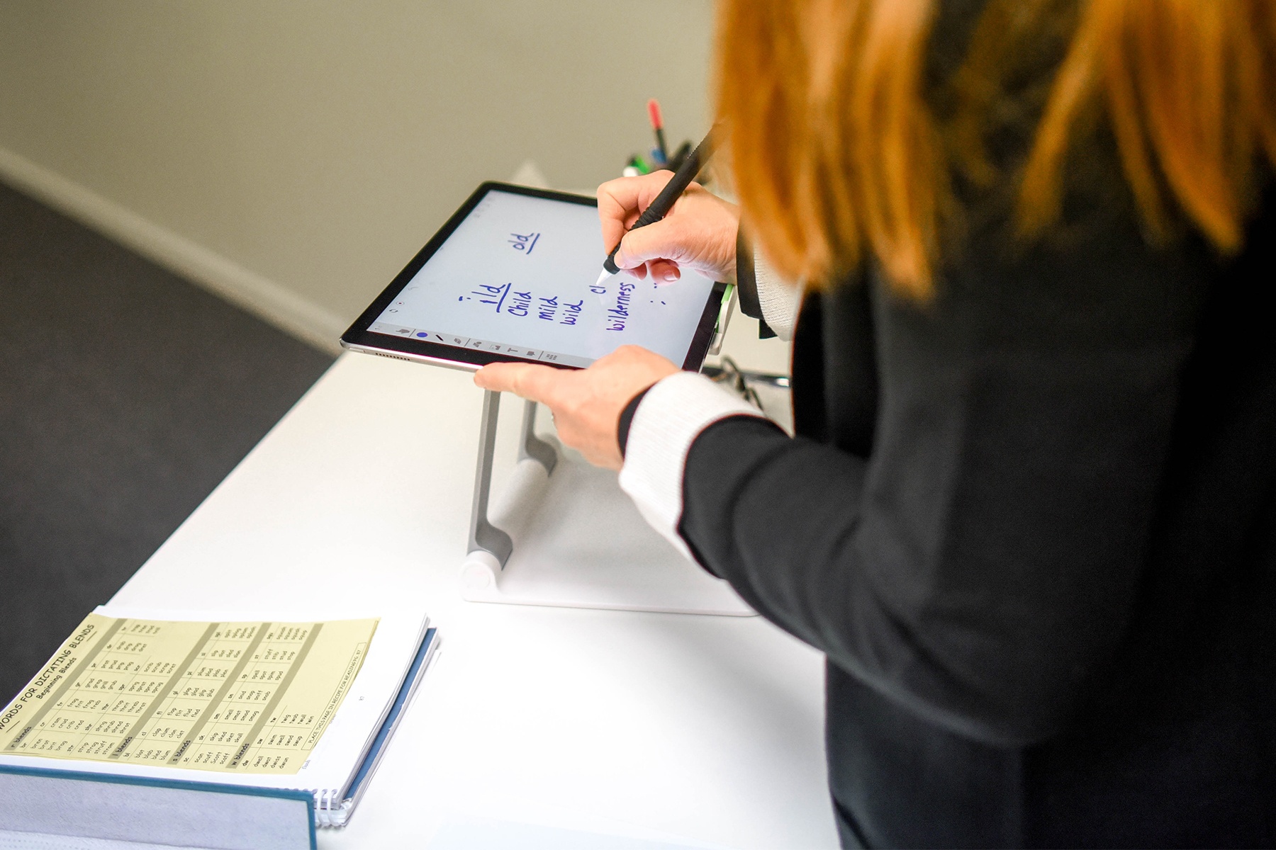 imse instructor writing on ipad