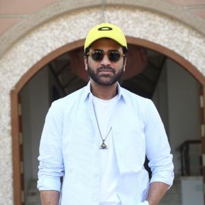 Actor Sharwanand Casual Style with Sunglasses and Yellow Cap