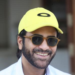 Actor Sharwanand Casual Style with Sunglasses and Yellow Cap