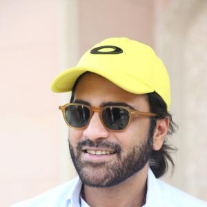Actor Sharwanand Casual Style with Sunglasses and Yellow Cap