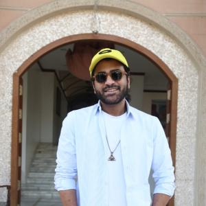 Actor Sharwanand Casual Style with Sunglasses and Yellow Cap