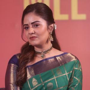 Traditional look of Sreemukhi in gold zari saree at event