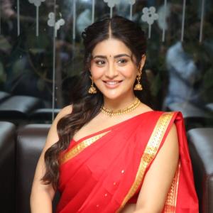 Raashi Singh Looks Radiant in Red Saree and Gold Jewellery