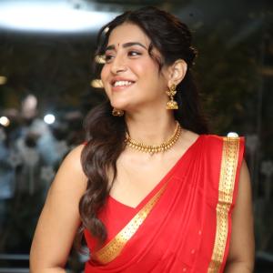 Raashi Singh Looks Radiant in Red Saree and Gold Jewellery
