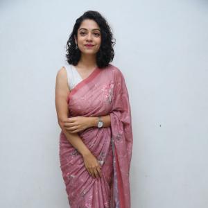 Classic Cultural Style of Actress Varsha Bollamma in a Floral Pink Saree