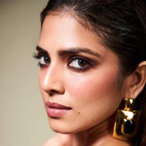 Malavika Mohanan Dazzles in Glossy Black Dress with Modern Accessories