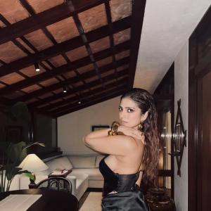 Malavika Mohanan Dazzles in Glossy Black Dress with Modern Accessories