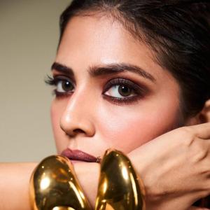 Malavika Mohanan Dazzles in Glossy Black Dress with Modern Accessories